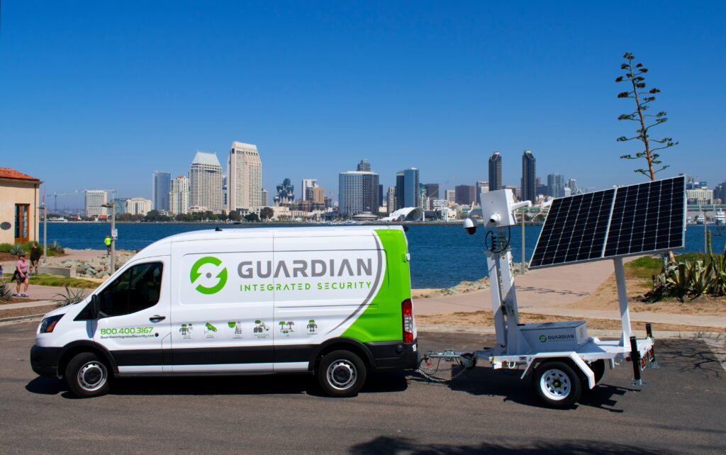 Security camera overlooking the gated entrance of a California apartment complex at night