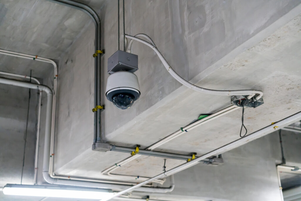 Storage unit security monitoring system inside a climate-controlled facility corridor