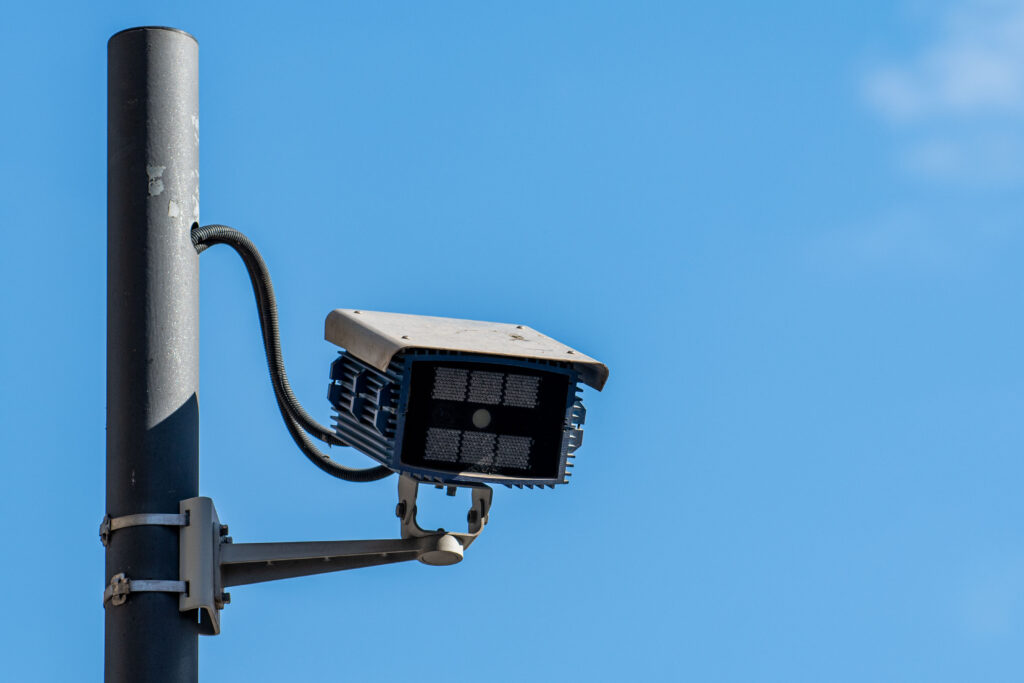 License plate recognition camera at a parking lot entrance for vehicle tracking